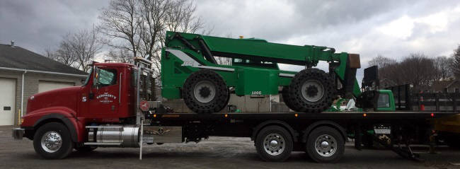 Heavy duty Flatbed loaded with large construction equipment