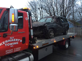 Flatbed image of a loaded SUV from a rollover accident in Rochester NY