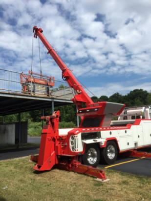 Lifting  a scissors lift onto a upper platform with Kerhaert's 50 ton sliding rotator.