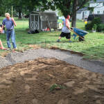 Backyard landscaping being installed.
