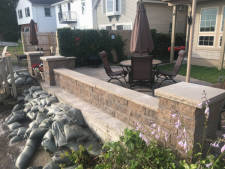 Hardscaped wall and patio area Installed by Aaron of Landscape Solutions. Rochester NY. 14616

585-342-5296