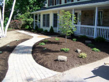 Paverstone sidewalk and mulched landscaping