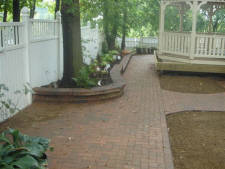 Paver block sidewalk and flower landscaping